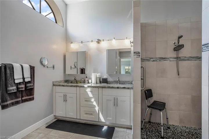 Primary en suite bath with upgraded shower, double vanity, plus tub.