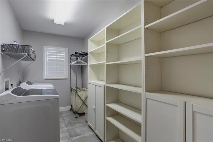 Extra large laundry room includes washer and dryer plus abundant storage.