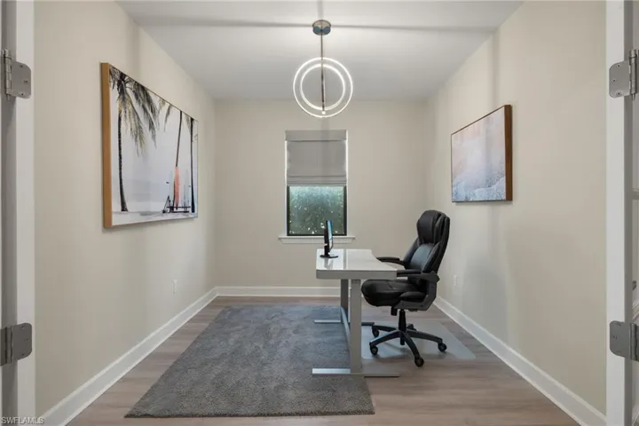 Office area featuring wood-type flooring