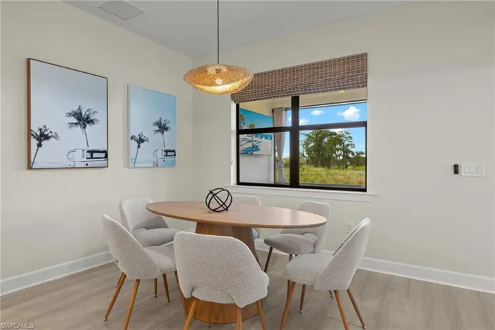 Dining room with light hardwood / wood-style flooring