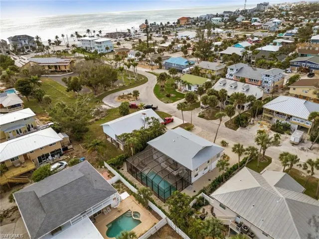 Birds eye view of property with a water view