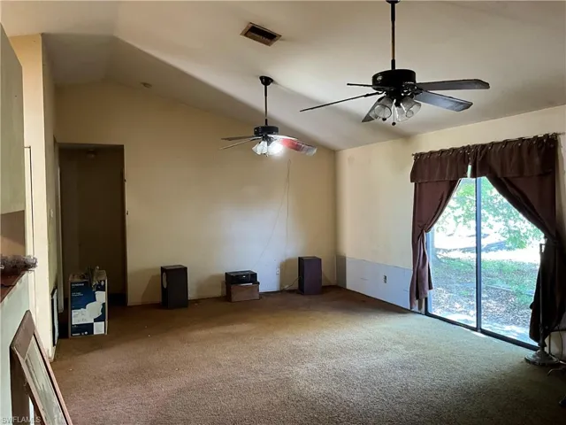 Open living area with nice vaulted ceilings.