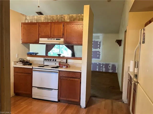 Dine in kitchen with nice windows.