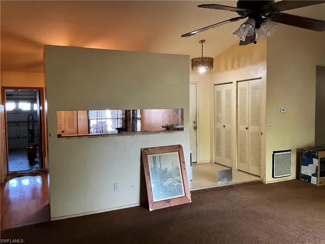 Divided wall with Pass thru from kitchen area.