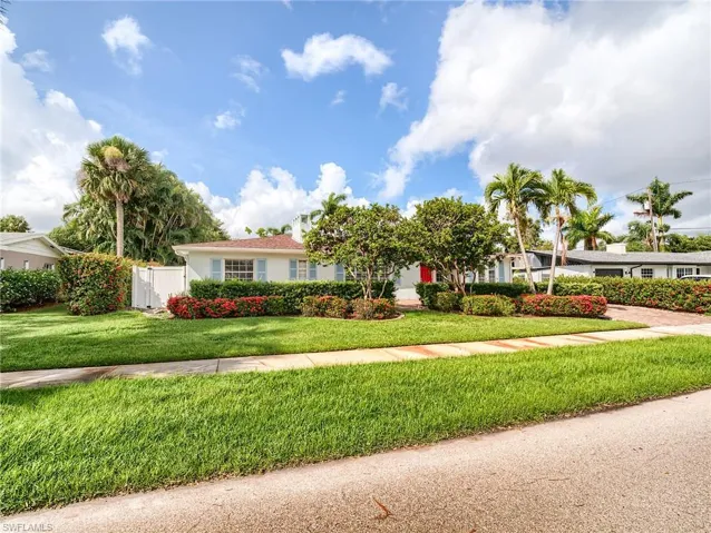 Single story home featuring a front yard