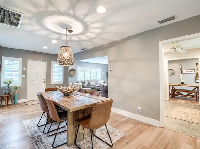 Dining area featuring ceiling fan and light tile flooring