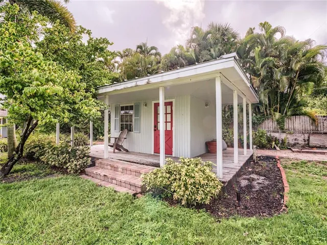 View of front of property with a front lawn