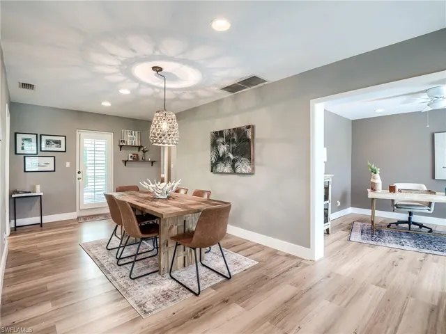 Dining room with ceiling fan and light hardwood / wood-style flooring
