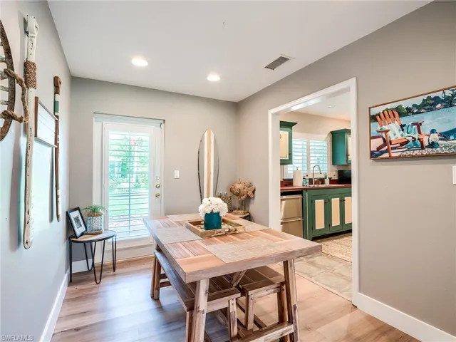 Dining area featuring sink and light hardwood / wood-style floors