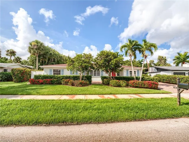 Single story home featuring a front yard