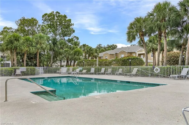Community pool with a patio