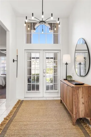 Stunning foyer with soaring ceiling and new chandelier.