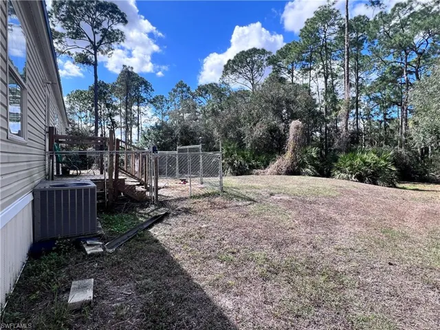 View of yard featuring a wooden deck