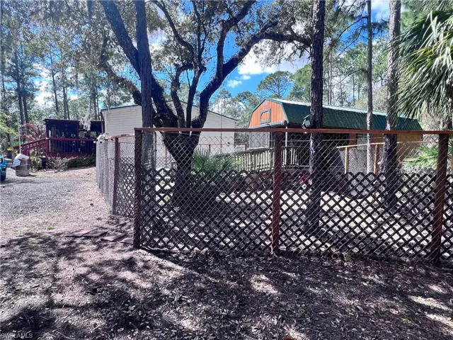 Gate featuring an outbuilding