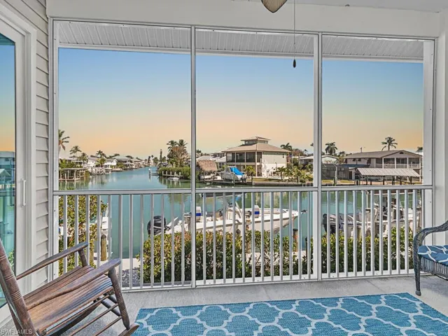 Sunroom / solarium with a water view