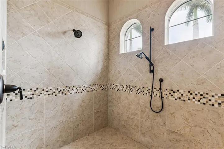 Bathroom featuring tiled shower