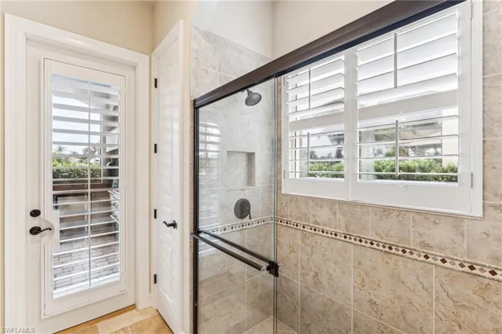 Full pool bathroom with outside entrance shower