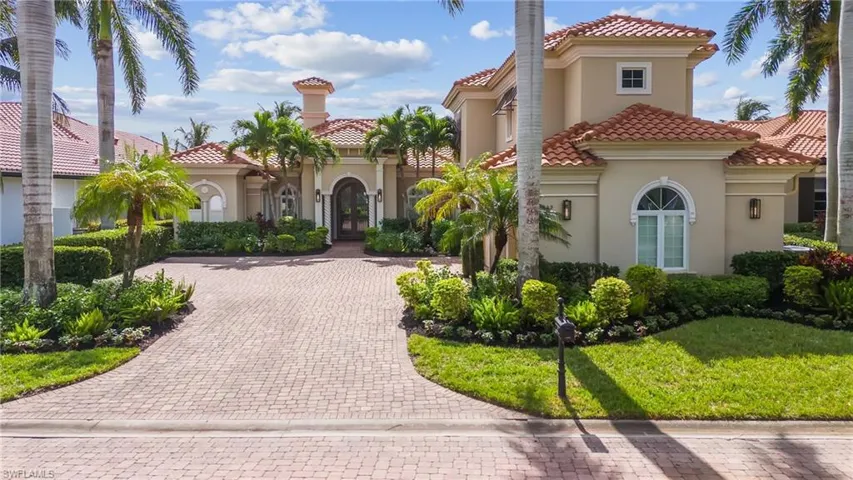 Mediterranean / spanish-style home with a front lawn