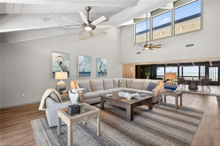 Living room featuring wood finished floors and ceiling fan