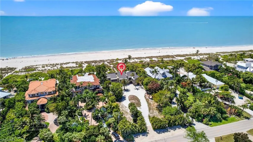 Aerial perspective of suburban area featuring unending shoreline