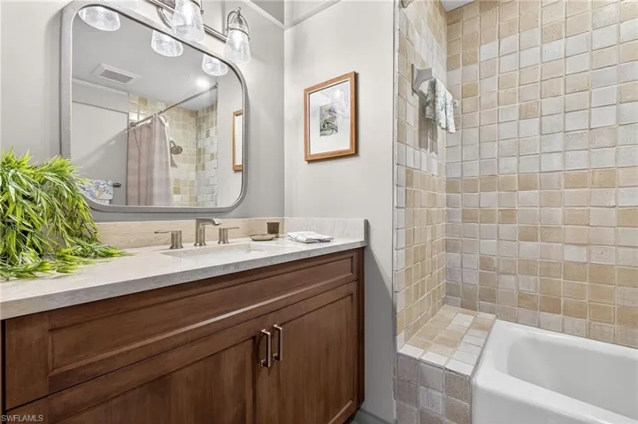 Full bathroom with vanity and shower / tub combo