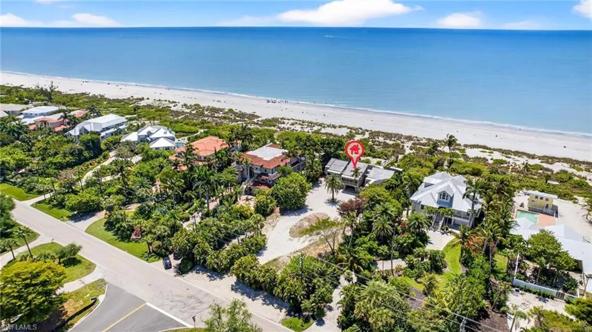 Aerial view of residential area with unending shoreline