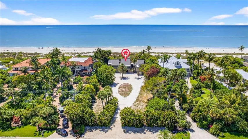 Aerial view of residential area with expansive beach