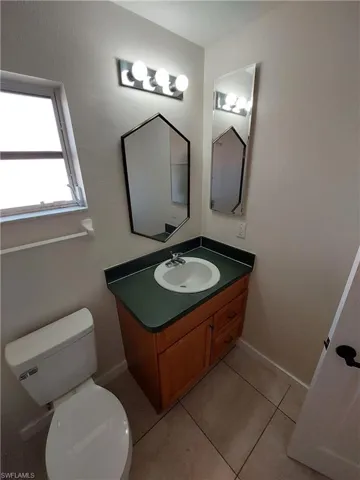 Bathroom with vanity and light tile patterned floors