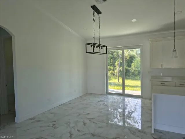 Polished tile flooring, white shaker cabinetry, recessed lighting, and a modern rectangular chandelier