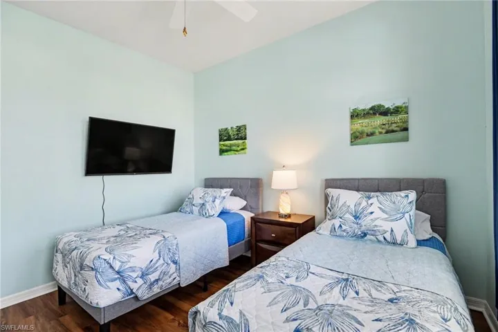 Bedroom with wood finished floors and ceiling fan