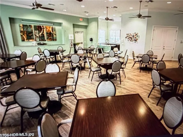 Dining room featuring a ceiling fan, wood finished floors, and recessed lighting