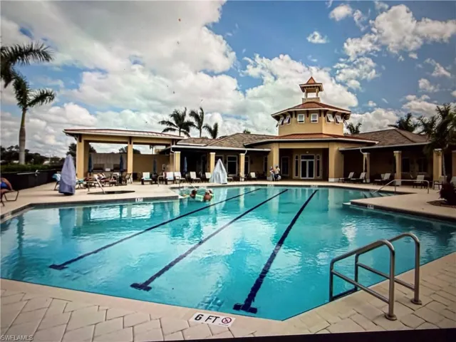 Community pool featuring a patio