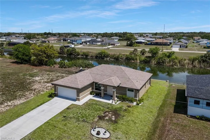 Aerial perspective of suburban area with a large body of water