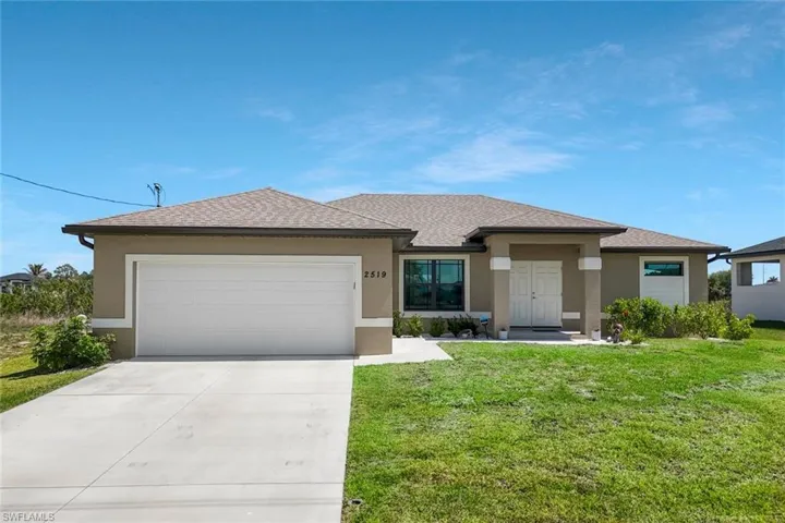 Newer Built house with an attached garage, stucco siding, concrete driveway, a front yard, and roof with shingles
