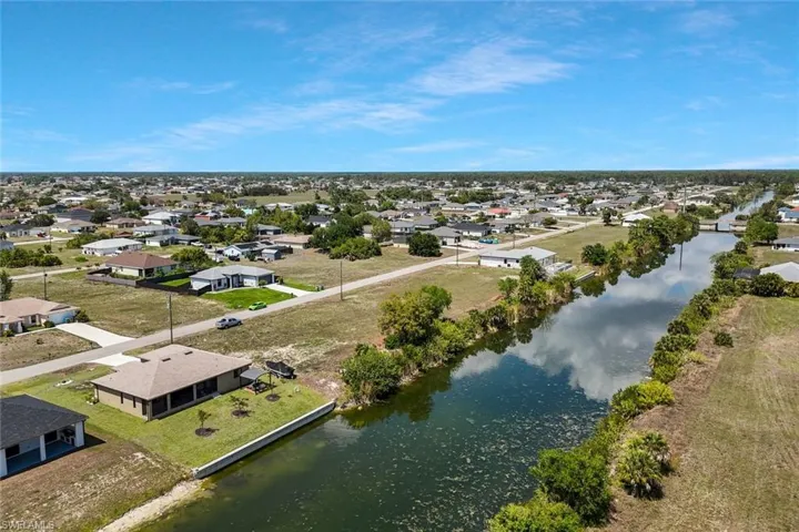 Aerial view of residential area with a nearby body of water