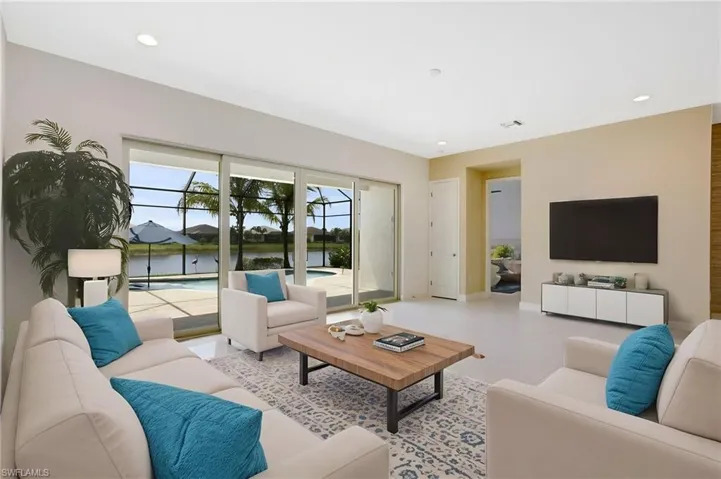 Living area with baseboards and recessed lighting