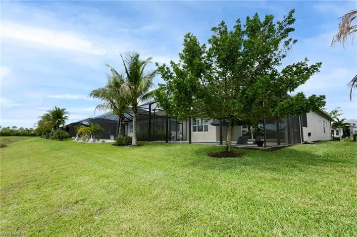 View of yard with glass enclosure