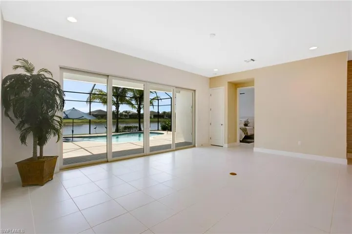 Spare room featuring baseboards, recessed lighting, and light tile patterned floors