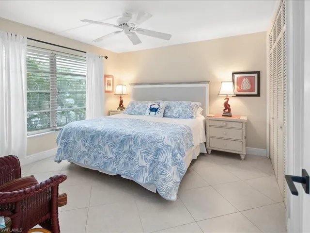 Primary bedroom with kings size bed and lots of light.