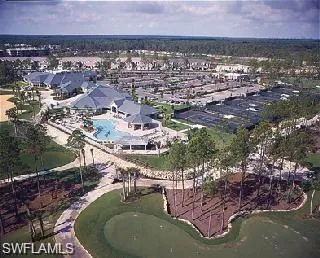 Aerial view of property's location featuring nearby suburban area