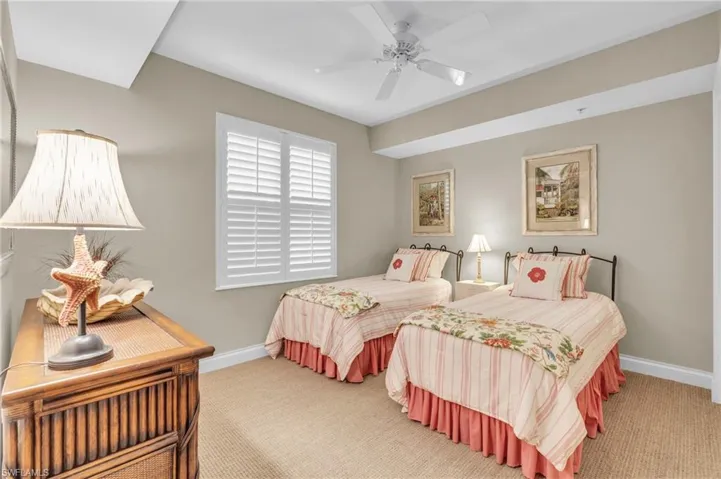 Guest Bedroom with carpet floors and ceiling fan