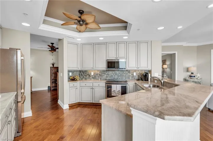 Kitchen featuring Granite Countertops, newer appliances and the entrance to the Den area