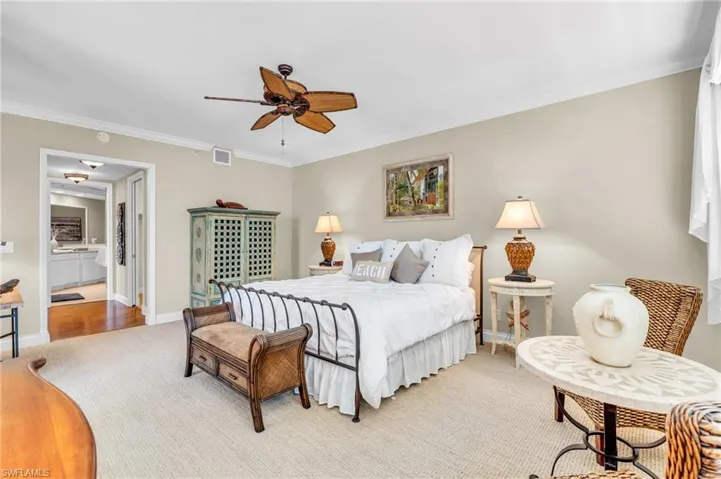 Main Bedroom featuring ceiling fan, Ensuite bath, and crown molding