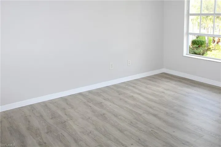 Master Bedroom featuring baseboards and wood finished floors