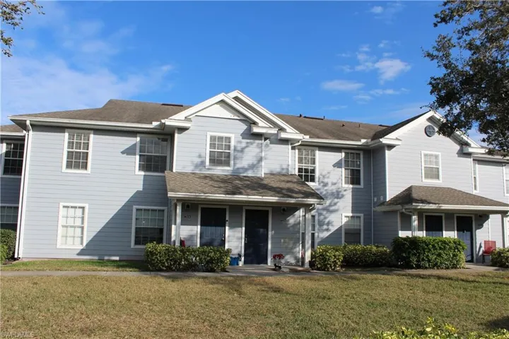 View of property featuring a front yard