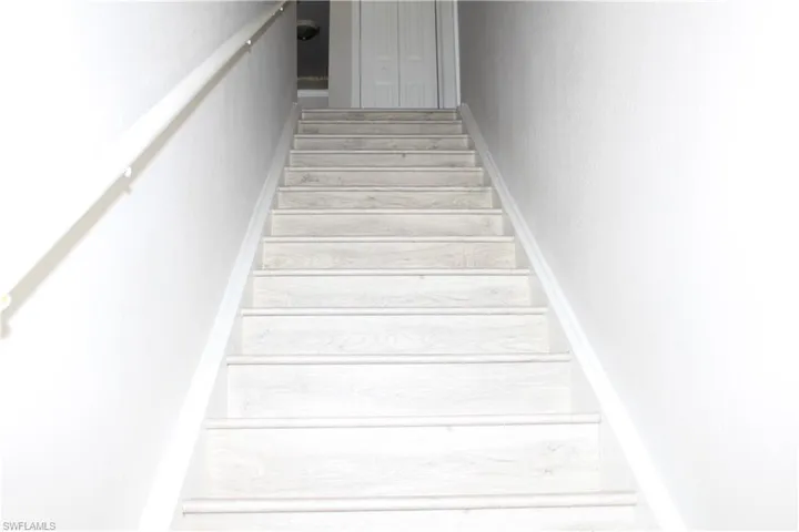 Staircase with wood finished floors