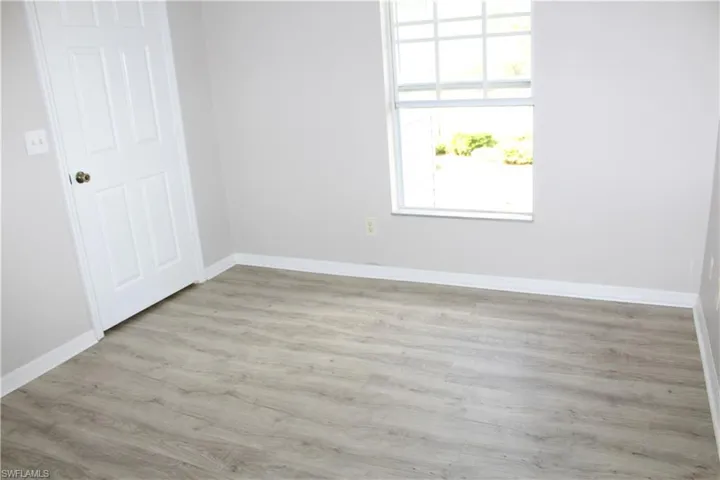 3rd Guest Bedroom featuring baseboards and wood finished floors