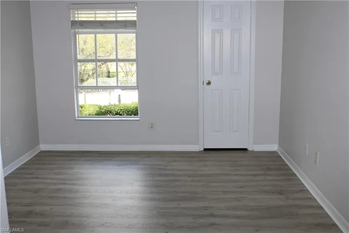 Master Bedroom featuring baseboards and wood finished floors