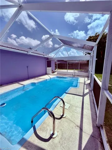 Swimming pool with a patio and a lanai