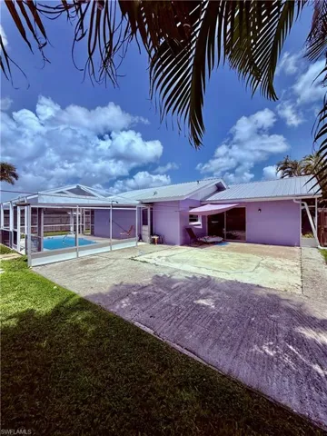 View of yard featuring a patio and an outdoor pool